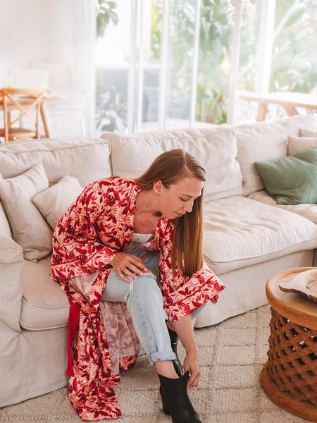 Getting ready to go out in red tropical robe with jeans and boots in casualwear from the living room to cafe and lunch