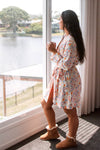 Pastel Paisely short robe wearing with ugg boots lounging with coffee reflecting