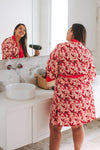 Red Floral Robe getting ready robe drying hair in a luxury bathroom